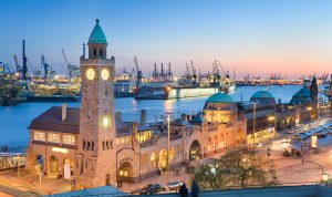 Landungsbruecken and the harbor at night in Hamburg, Germany.